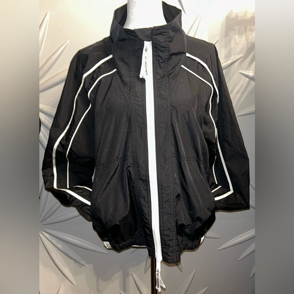 FP Movement by Free People Jackets & Blazers - NWT FP Movement SZ M black/white dual direction, zip front jacket w/pockets.